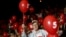 A supporter of the Bulgarian Socialist Party holds a balloon during an election rally at the National Palace of Culture in Sofia, Bulgaria, May 9, 2013.