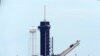 The SpaceX Falcon 9, with the Dragon capsule on top of the rocket, is raised onto Launch Pad 39-A, May 26, 2020.