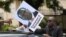 A protester holds a poster showing support for ousted Zimbabwean Vice President Emmerson Mnangagwa, in Harare, Zimbabwe, Nov. 18, 2017.