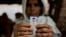 Kareeman Bano holds a photograph of her son-in-law Rakbar Khan, who was killed by a mob on suspicion of cattle smuggling, in Kolgaon village, India, July 24, 2018. Mob attacks on minority groups have occurred since the Hindu nationalist BJP swept elections in 2014.