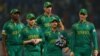 South African players Quinton de Koc, David Miller and teammates walking off the field after their loss to Australia at the 2023 Cricket World Cup in India
