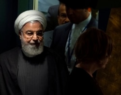 Iran's President Hassan Rouhani walks toward the podium before addressing the 74th session of the United Nations General Assembly, Sept. 25, 2019.