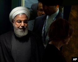 Iran's President Hassan Rouhani walks toward the podium before addressing the 74th session of the United Nations General Assembly, Sept. 25, 2019.