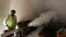 FILE - A public health department worker fumigates inside a house to prevent the spread of mosquito borne diseases in New Delhi, India, Oct. 9, 2018.