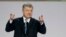 FILE - Then-Ukrainian President Petro Poroshenko gestures while speaking at a gathering with supporters in Kyiv, Ukraine, Jan. 29, 2019.