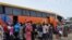 FILE - People board a commercial bus to flee following attacks by Boko haram in Bama and other parts of  Maiduguri, Nigeria, Sept. 8, 2014.  