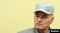 FILE - Former Bosnian Serb commander Ratko Mladic appears in court at the International Criminal Tribunal for the former Yugoslavia (ICTY) in the Hague, Netherlands, June 3, 2011.