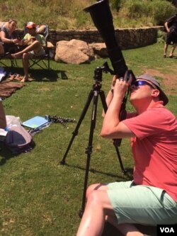 Millions of people across the United States watched a rare total solar eclipse which darkened the skies from the Pacific to the Atlantic for the first time in 99 years.