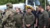 Presiden Ukraina Volodymyr Zelenskiy mengunjungi daerah banjir setelah bendungan Nova Kakhovka jebol, di tengah serangan Rusia terhadap Ukraina, di Kherson, Ukraina 8 Juni 2023.