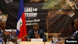 Prezidan Jovenel Moise ki tap pale pandan enstalasyon Premye minis enterimè a Jean-Michel Lapin nan Palè Nasyonal, Pòtoprens, Ayiti 21 mas 2019. Foto: REUTERS/Andres Martinez Casares - RC1BA08CB400