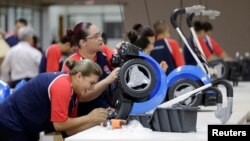 Workers assemble riding toys for Brazilian toymaker Estrela at a factory in Hernandarias, Paraguay Feb. 7, 2017.