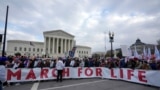 Participants in the annual March for Life pose in front of the U.S. Supreme Court in Washington, Jan. 24, 2025.