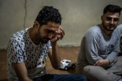 Omid Suleyman Zada, 26 weeps while describing the death of his brother at the hands of Taliban fighters on April 10, 2021 in Van, Turkey. (Claire Thomas/VOA)