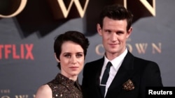 FILE - Actors Claire Foy, who plays Queen Elizabeth II, and Matt Smith, who plays Philip Duke of Edinburgh, attend the premiere of "The Crown" Season 2 in London, Nov. 21, 2017. 