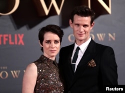 FILE - Actors Claire Foy, who plays Queen Elizabeth II, and Matt Smith, who plays Philip Duke of Edinburgh, attend the premiere of "The Crown" Season 2 in London, Nov. 21, 2017.
