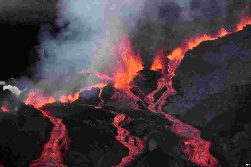 Lava flows out of the Piton de la Fournaise volcano as it erupts on the French island of La Reunion in the Indian Ocean.