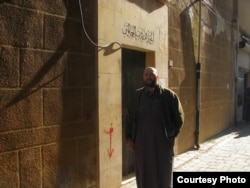 Mohamed Khairullah in front of his family’s home in Aleppo, Syria, where his third great-grandfather is buried. “The area is almost completely deserted now,” he said. (Courtesy of Mohamed Khairullah)