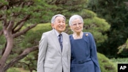 In this photo provided by the Imperial Household Agency of Japan, its Emperor Emeritus Akihito and Empress Emerita Michiko pose for a photograph in Tokyo, Oct. 4, 2024.