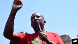 FILE - Leader of the Economic Freedom Fighters (EFF) Julius Malema addresses supporters in Pretoria, South Africa, on March 20, 2023. 