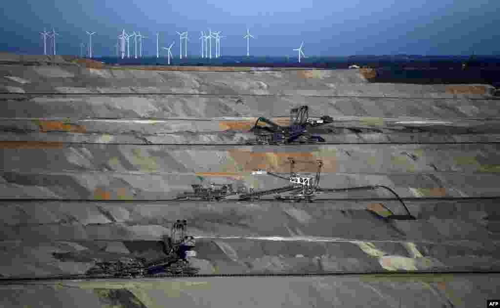 Excavators work at the Hambach open-pit lignite (brown coal) mine operated by German energy producer RWE in Niederzier and Elsdorf, western Germany.