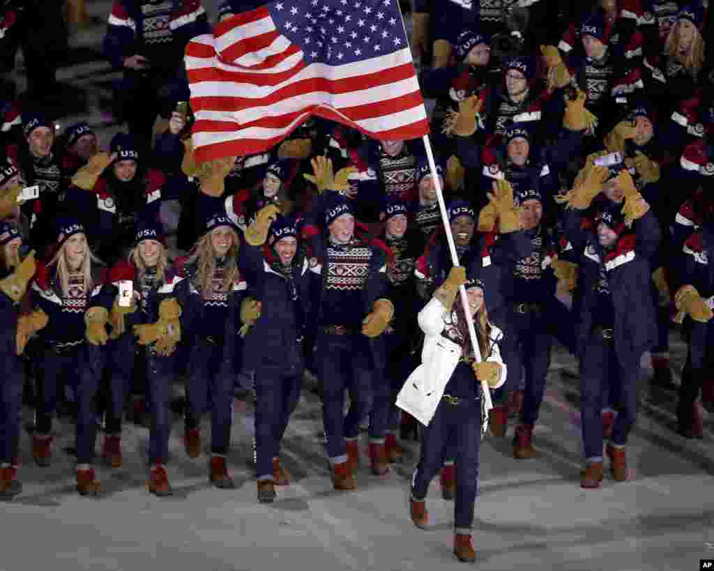 Erin Hamlin carries the flag of the United States during the opening ceremony of the 2018 Winter Olympics in Pyeongchang, South Korea, Feb. 9, 2018