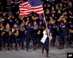 Erin Hamlin carries the flag of the United States during the opening ceremony of the 2018 Winter Olympics in Pyeongchang, South Korea, Feb. 9, 2018