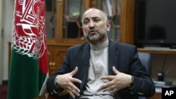 FILE - Afghan National Security Adviser Mohammad Hanif Atmar speaks during an interview with The Associated Press, in Kabul, Afghanistan.
