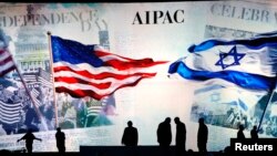 FILE - Workers prepare the stage at the American Israel Public Affairs Committee (AIPAC) policy conference in Washington, March 2, 2015.