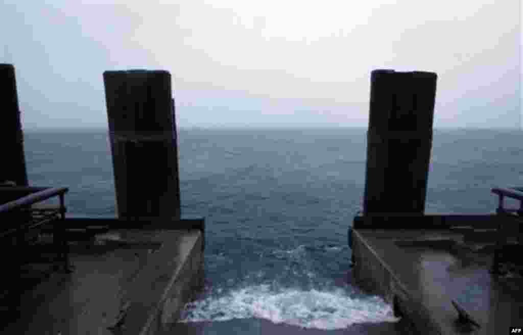 Rising water laps along the seawall in Battery Park as Hurricane Irene approaches New York, Sunday, August 28, 2011. Battery Park and other areas in Lower Manhattan have been evacuated in advance of the storm. (AP Photo/Jason DeCrow)