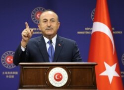 FILE - Turkish Foreign Minister Mevlut Cavusoglu attends a press conference in Ankara, Turkey, Aug. 25, 2020.