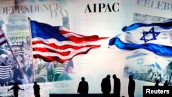 Workers prepare the stage at the American Israel Public Affairs Committee (AIPAC) policy conference in Washington.