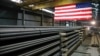 FILE -FILE - Steel rods await shipment at a mill in St. Paul, Minn., May 9, 2019.