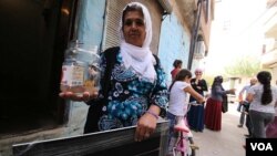 Fatma Oren’s family did not forget to take their goldfish when they were among those forced to leave Sur’s Ali Pasa neighborhood, which was among several that were damaged in clashes. Many don’t want to leave and say the government compensation is too little. (M. Bozarslan/VOA)