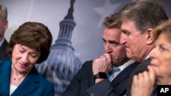 From left, Sen. Susan Collins, R-Maine, Sen. Jeff Flake, R-Ariz., Sen. Joe Manchin, D-W.Va., and Sen. Jeanne Shaheen, D-N.H., finish a news conference on the bipartisan immigration deal they reached, during a news conference at the Capitol in Washington, Feb. 15, 2018. That plan and three others seeking immigration reform were all ultimately rejected.