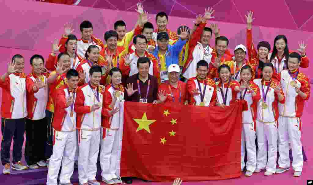 The entire Chinese badminton team, with gold medal winners in front row, pose for a photo at the end of the competition at the 2012 Summer Olympics in London, August 5, 2012. 