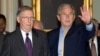 FILE - U.S. President George W. Bush walks with Senate Minority Leader Mitch McConnell after arriving at the Capitol for talks on an immigration reform bill in Washington, June 12, 2007. First elected in 1984, McConnell announced on Feb. 20, 2025, he would retire from the Senate.