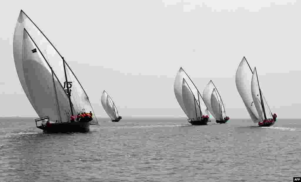 Emirati competitors sail a traditional dhow during the Marwah Traditional Dhow Sailing race, as part of Al-Dhafra Water Festival, off the coast of al-Mirfa beach, outside Abu Dhabi, April 21, 2018.