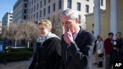 Special Counsel Robert Mueller, and his wife Ann, depart St. John's Episcopal Church, across from the White House, in Washington, March 24, 2019. 