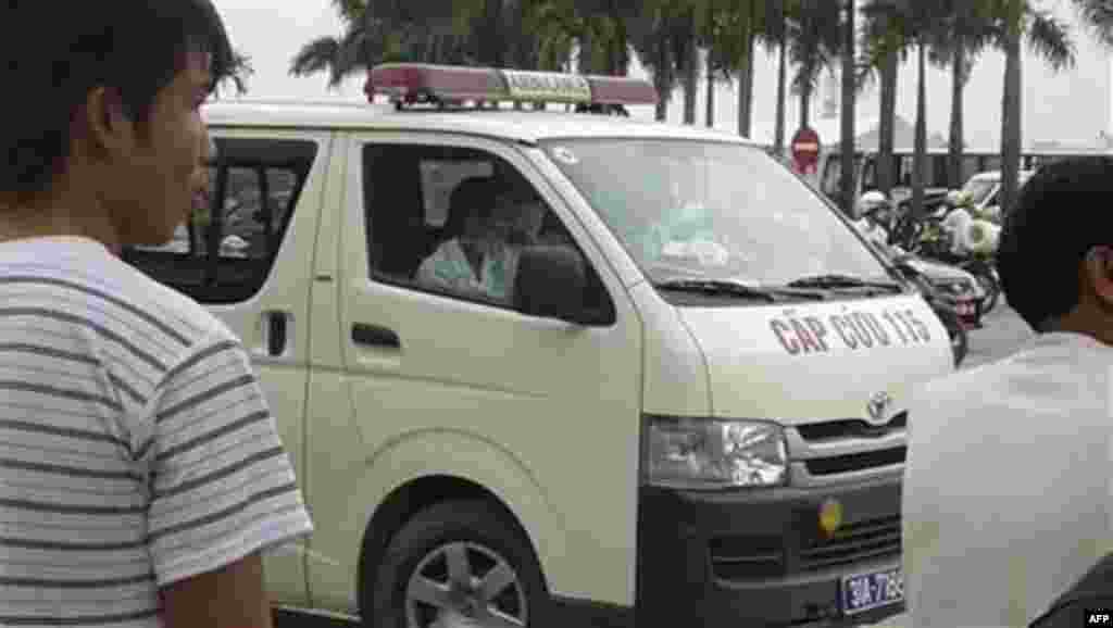 An ambulance is parked outside My Dinh National Stadiuim in Hanoi, Vietnam, Wednesday, Oct. 6, 2010 following a fireworks explosion that killed four people and injured three others. Fireworks intended for Hanoi's upcoming 1000th birthday celebration explo