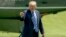President Donald Trump points to members of the media as he arrives on the South Lawn of the White House in Washington, May 25, 2018. 