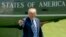 President Donald Trump points to members of the media as he arrives on the South Lawn of the White House in Washington, May 25, 2018. Trump accused The New York Time of using a "phony source" who turned out to be a White House official briefing several reporters.