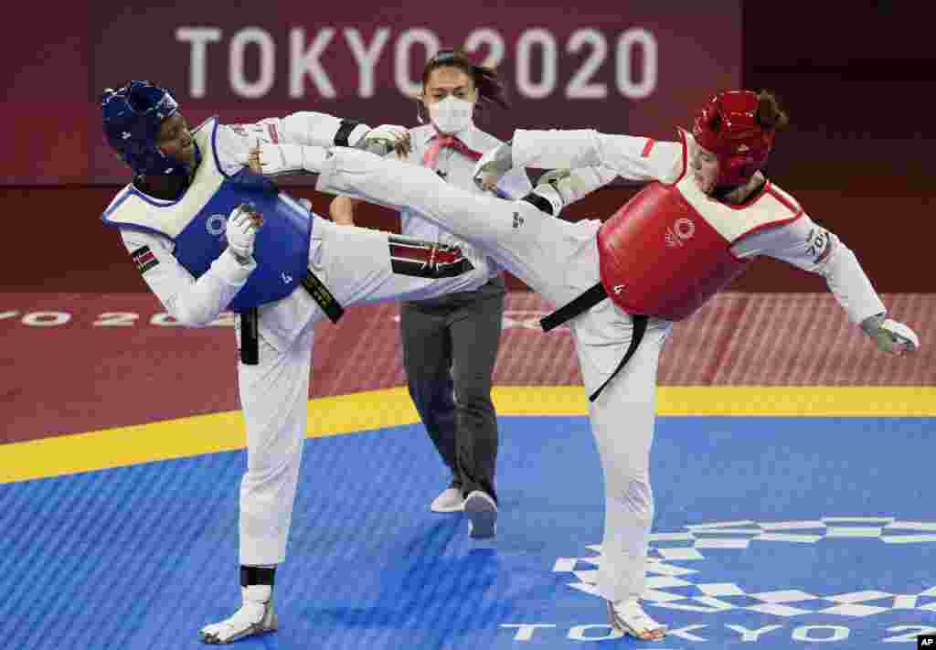 Kenya&#39;s Faith Ogallo, left, competes with Poland&#39;s Aleksandra Kowalczuk during the taekwondo women&#39;s 67kg match at the 2020 Summer Olympics, Tuesday, July 27, 2021, in Tokyo, Japan. (AP Photo/Themba Hadebe)