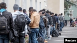 FILE - Asylum seekers arrive at a refugee reception center in the northern town of Tornio, Finland Sept. 25, 2015. 