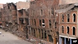 A vehicle destroyed in a Christmas Day explosion remains on the street, Dec. 29, 2020, in Nashville, Tenn.