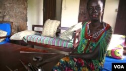 South Sudanese fashion designer and anthropologist Akuja de Garang hopes to promote the country's bullet blacksmiths and others using shell casings to make spears, pipes and jewelry before such skills are lost, Oct. 2013. (H. McNeish/for VOA)