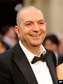 FILE - Hany Abu-Assad, pictured at the Academy Awards in Los Angeles, March 2, 2014, will have his "The Mountain Between Us," starring Idris Elba and Kate Winslet, shown at this year's Toronto International Film Festival.