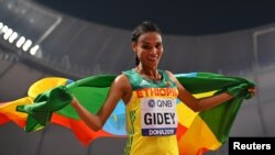 FILE: Ethiopia's Letesenbet Gidey celebrates her silver medal victory at the World Athletic Championships held in 2019 in Doha, Qatar.