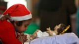 A girl prays at Saint Mary&#39;s Garrison Church in Jammu, India, Dec. 25, 2016.&nbsp;Though the Hindus and Muslims comprise majority of the population in India, Christmas is a national holiday celebrated with much fanfare.