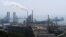 FILE - A refinery is seen near the downtown of Dalian in Liaoning province, China July 17, 2018. REUTERS/Chen Aizhu