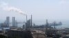 China National Petroleum Corporation (CNPC)'s Dalian Petrochemical Corp refinery is seen near the downtown of Dalian in Liaoning province, China July 17, 2018. Picture taken July 17, 2018. REUTERS/Chen Aizhu